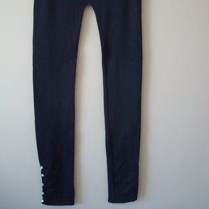 Ladies leggings with 5 stud attachment on ankles
